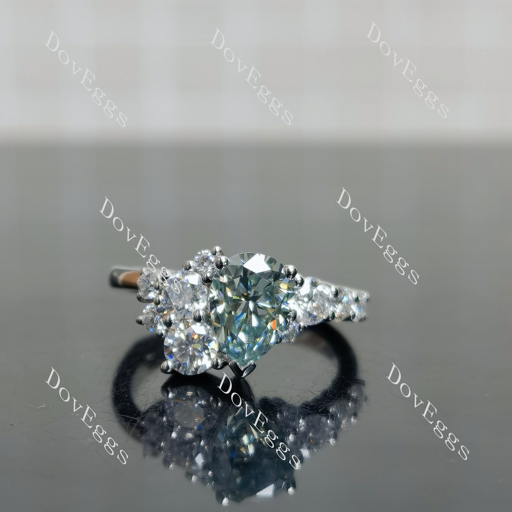 Doveggs pear side stones colored moissanite engagement ring