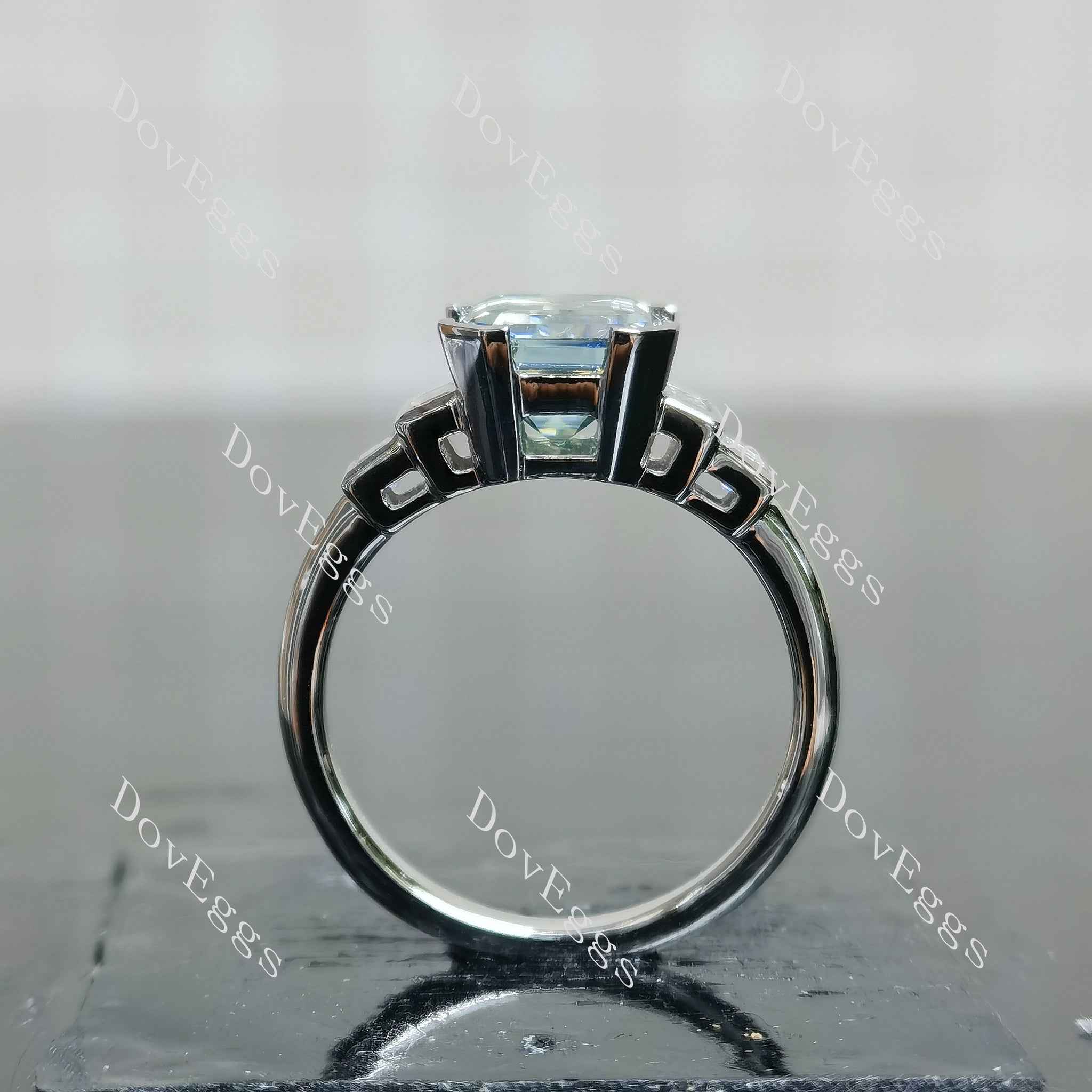 Doveggs emerald bezel side stones colored moissanite engagement ring