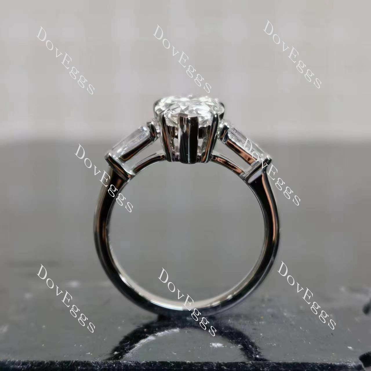 The Maddox pear three stones moissanite engagement ring