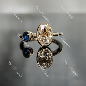 DovEggs oval two stones bezel colored moissanite engagement ring