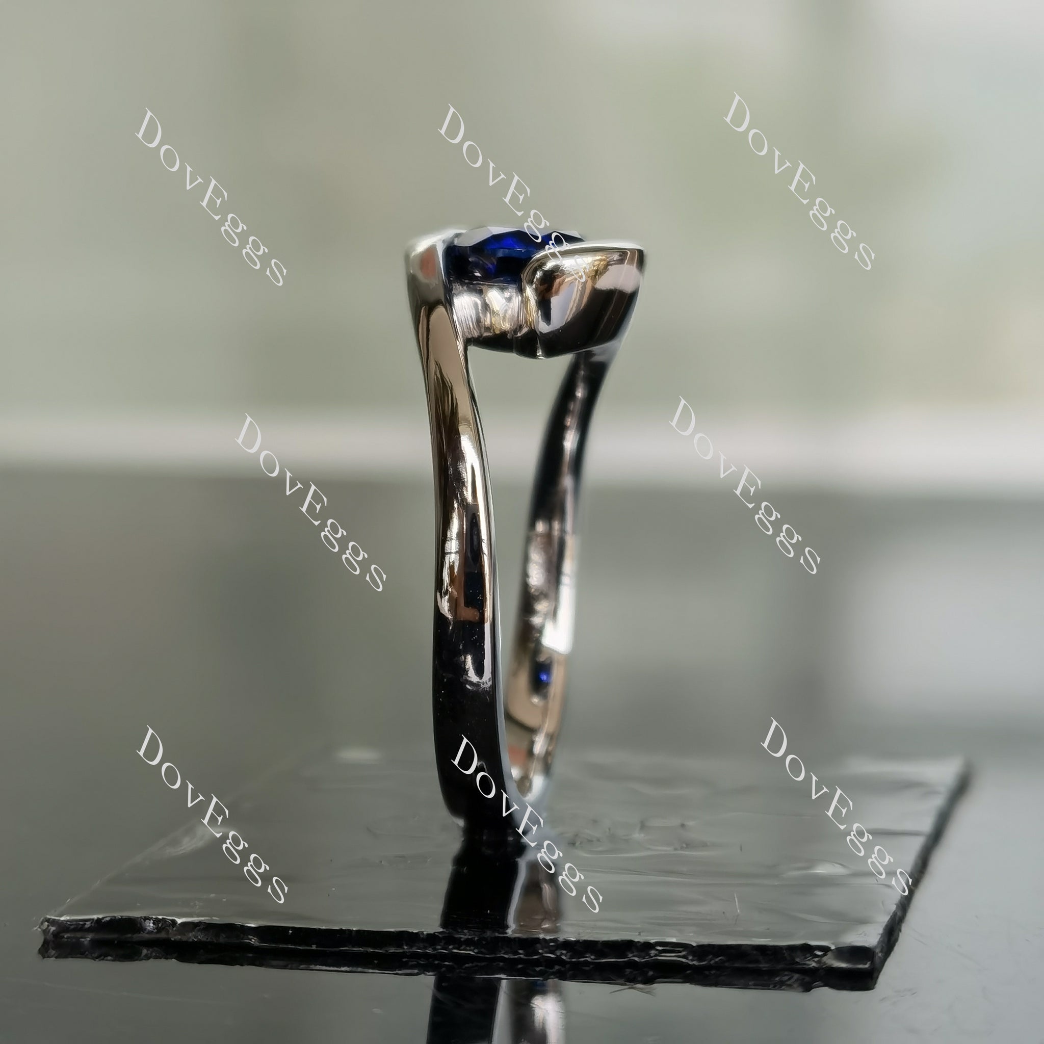 Ocean Wave round solitaire intense royal blue sapphire colored gem engagement ring